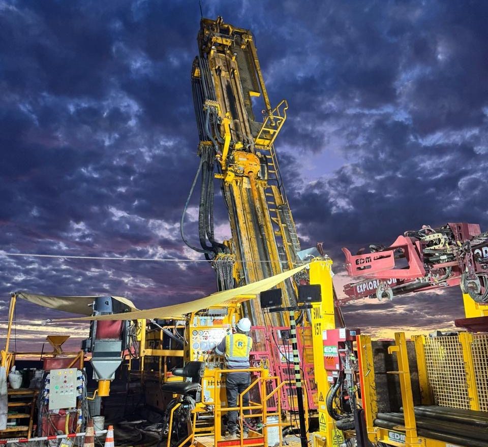 Geodrill drill rig operating at night under floodlights